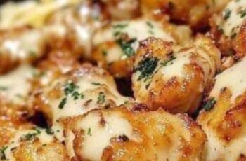 Golden Garlic Chicken Bitesover Creamy ParmesanPasta
